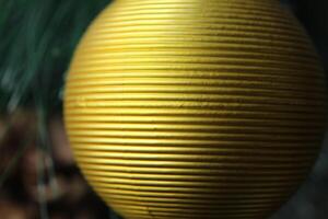 yellow golden textured ball close-up to the place for the text of the copy space photo
