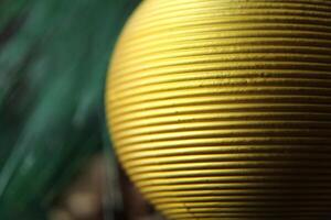 yellow golden textured ball close-up to the place for the text of the copy space photo