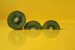 pieces of kiwi halves with a trend of Illuminating yellow color with a place to insert a copyspace photo