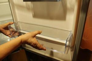 Cleaning cleaning fridge sink wipes the shelf inserts the shelf photo