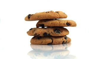 Chocolate Chip Cookies stacked on a white background with space for copyspace text. Chocolate Biscuit Isolate photo