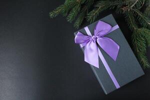 Gift Box Black on Green Black Blue Red Pink Background with Space for Copy Space Text photo
