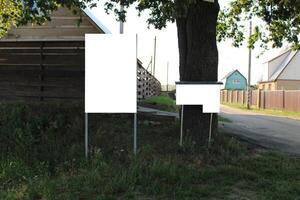 mock up stand signboard in the countryside dacha village near the wooden house photo