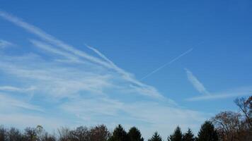 The blue sky view with the flying trail by the aircraft photo