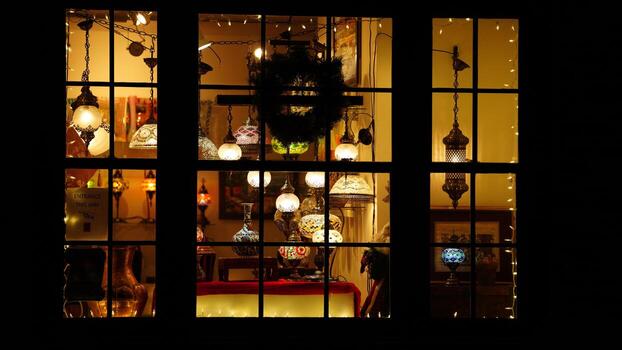 The lights show window view with the lights on at night photo