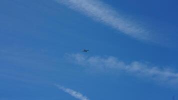 The blue sky view with the flying trail by the aircraft photo