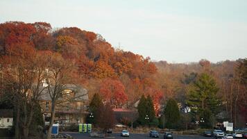 The beautiful little town landscape with the colorful autumn leaves and old buildings in USA photo