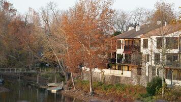 The beautiful little town landscape with the colorful autumn leaves and old buildings in USA photo