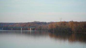 One old rion frames bridge view on the river with the sunset sky as background photo