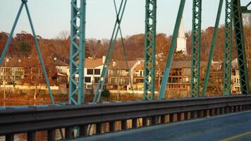 One old rion frames bridge view on the river with the sunset sky as background photo