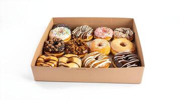 A box of assorted donuts on a white surface photo