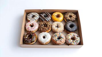 A box of donuts with different flavors and toppings photo