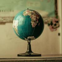 a globe on a table in front of a map photo