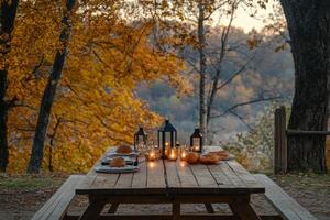 Rustic Table Setting with Lanterns and Pumpkins in an Autumn Forest photo