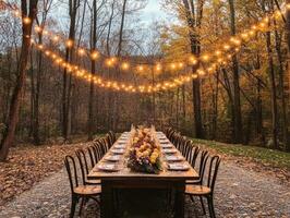 Rustic Autumnal Dinner Table Set in a Forest Clearing photo