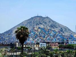 A mountain with many buildings on top of it photo