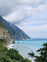 A view of the ocean from a hillside photo