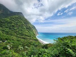 View of the coast of the caribbean from the top of a hill in st lucia photo