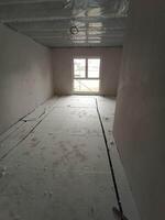 An Empty Room That is Currently Under Construction, Bathed in Abundant Natural Light photo