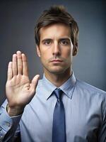 man making solemn vow with his hand raised in earnest photo