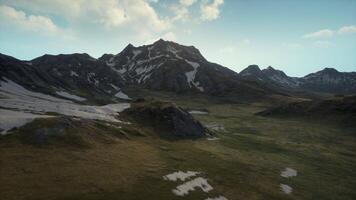 An aerial view of a mountain range with snow video