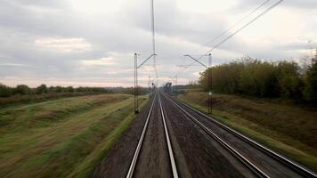 A close-up of the tracks captured while the train is in motion creates a dynamic sense of speed and travel. This shot conveys the energy of the journey and opens up new horizons. video