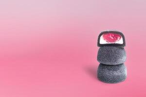 Mochi candy on a pink background, copy space photo