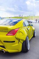 15.09.2024. Novosibirsk, Midday, Yellow Nissan Fairlady Z, 350 Z, Z33 with tuning back view photo
