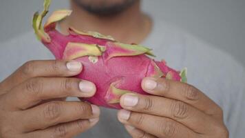 A Comprehensive Overview of Fresh Dragon Fruit Being Held in the Hands of a Person video