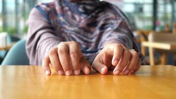 Hands Resting Calmly on a Table in a Comfortably Cozy Setting That Invites Relaxation video