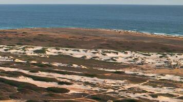 Aerial view around the western tip of the Caribbean island of Aruba video