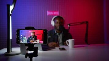 A blogger records content in his studio video