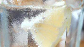 A Refreshing Glass of Lemonade Complete with Ice Chunks for a Deliciously Cool Experience video