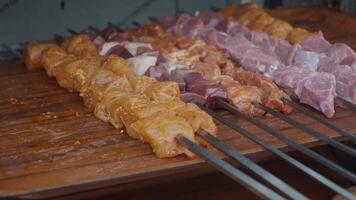 A tray of kebabs with meat and veggies a delicious dish on the table video