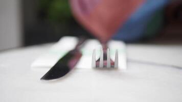 An Elegant and Beautiful Table Setting featuring a Knife and Fork placed neatly on a White Napkin video