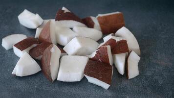 Delicious Fresh Coconut Chunks Right on a Dark Background and Setting for Your Eyes video