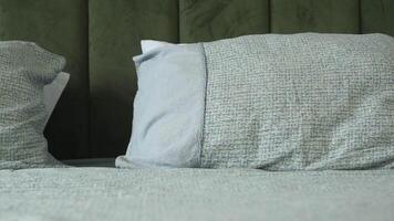 A cozy and inviting bedroom adorned with pillows and soft textiles for ultimate comfort video