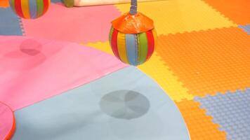 Colorful Bouncing Balls placed on a Play Mat designed specifically for Childrens fun Activities video