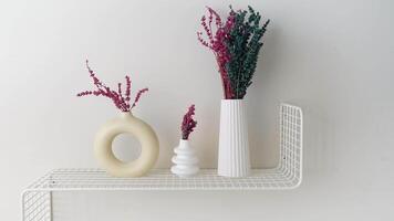 Beautiful and Stylish Shelf Decor Featuring Colorful Dried Flowers Arranged in Minimalist Vases video