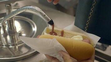 Enjoy a Delicious Hot Dog topped with Ketchup and Mustard at a Local Food Stand Today video