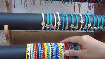 A Vibrant Array of Colorful Handmade Bracelets Elegantly Displayed for Sale at the Market video