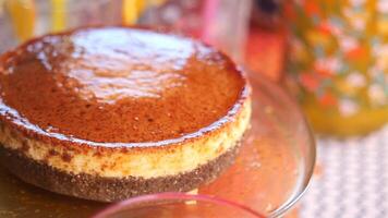 Caramel custard pudding on a plate on table video