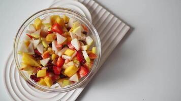 A Beautiful and Colorful Mixed Fruit Salad Presented in a Transparent Glass Bowl video