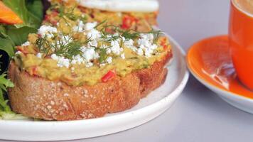Enjoy a Delicious Avocado Toast paired with Coffee served on a Modern and Stylish Table video