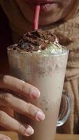 Enjoy a delicious chocolate milkshake topped with whipped cream and a fresh strawberry video