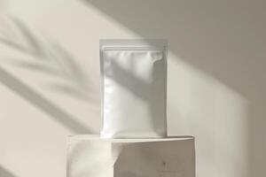 A white bag sitting on a block with a shadow photo