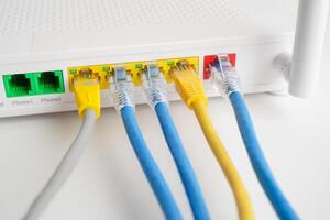 Ethernet cable with wireless router connect to internet service provider network. photo