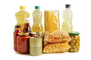 Foodstuffs in donation box isolated on white background with clipping path for volunteer to help people. photo