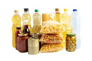 Foodstuff for donation isolated on white background, storage and delivery. Various food, pasta, cooking oil and canned food. photo