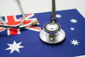 Stethoscope on Australia flag background, Business and finance. photo